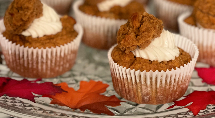 Picture of 3 Keto Pumpkin Spice Cream Cheese Muffins on a plate with colored fall leaves for the blog keto on the rise
