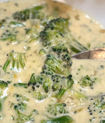Photo of Hearty Keto Broccoli and Cheddar soup in a soup pot on the stovetop for the blog keto on the rise