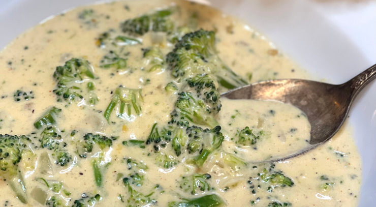 Photo of Hearty Keto Broccoli and Cheddar soup in a soup pot on the stovetop for the blog keto on the rise